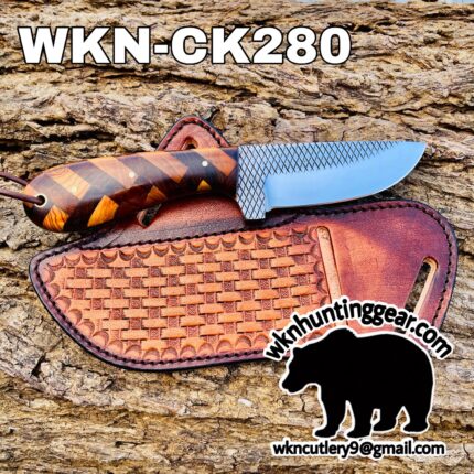 Knife with a checkered wood handle resting on a brown leather sheath on a rocky background; label reads WKN-CK280 at top.