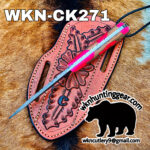 Pink tooled leather knife sheath with a long blade across it on a fur background; features bold 'WKN-CK271' branding and a black animal silhouette.