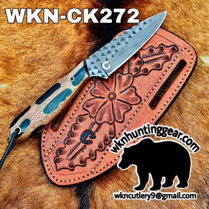 Close-up of a patterned steel knife resting on a red tooled leather sheath on a brown fur background, with bold text WKN-CK272 across the top and a black bear silhouette with a contact email at the bottom right.