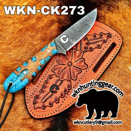 Damascus fixed‑blade knife with turquoise inlay on a brown leather sheath, set on fur background; model WKN-CK273, with huntinggear logo and a black elephant silhouette.
