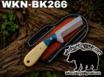 Fixed-blade knife with a blue-patterned handle resting in a brown leather sheath on a log; watermark shows wknhuntinggear.com in the corner.