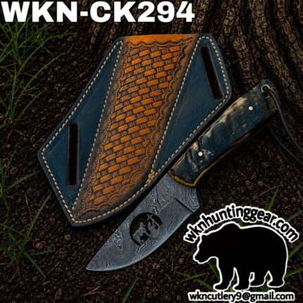 Damascus knife with blue leather sheath on soil, woven brown panel and white top text reading 'WKN-CK294'; watermark logo 'wkncutlery9' at bottom right.