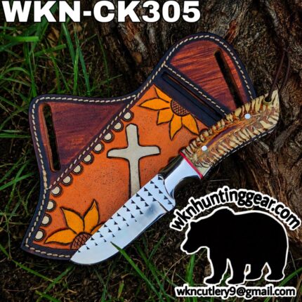 Knife with a decorative leather sheath on a tree trunk, featuring sunflower artwork and a patterned blade; brand watermark visible (WKN305).