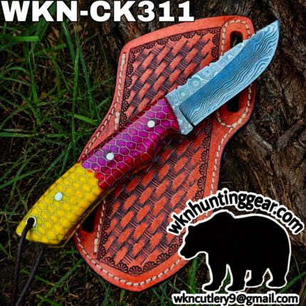 Colorful fixed-blade knife with a blue Damascus-patterned blade on an orange leather sheath outdoors, branding for wknhuntinggear.com