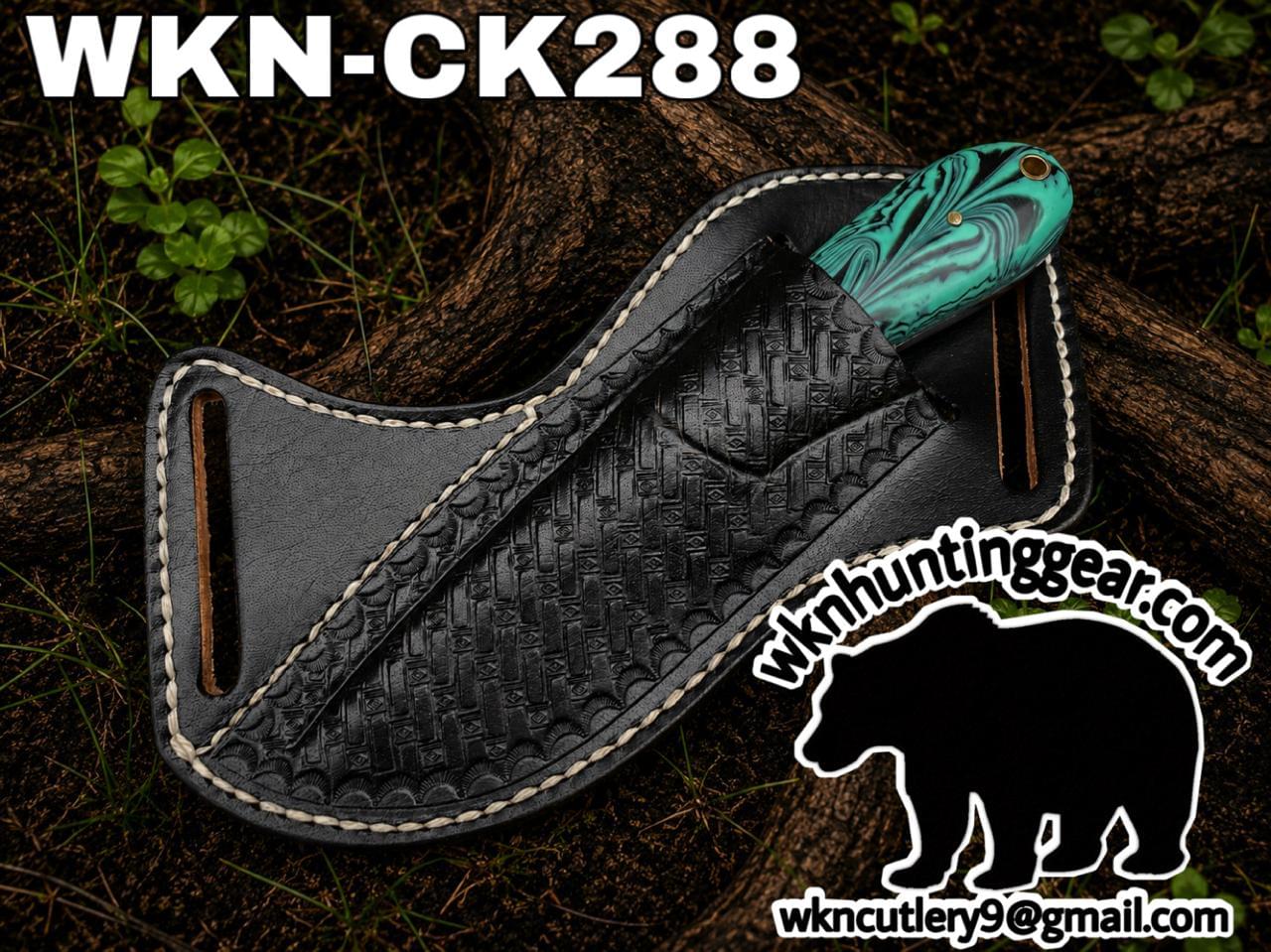 Teal marbled knife partly visible in a black leather sheath on a log, with WKN Hunting Gear branding.