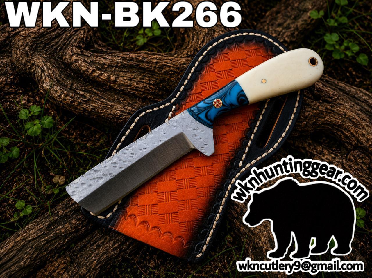 Fixed-blade knife with hammered blade on an orange leather sheath; blue/white handle, 'WKN-BK266' text visible, with wknhuntinggear logo and contact info.