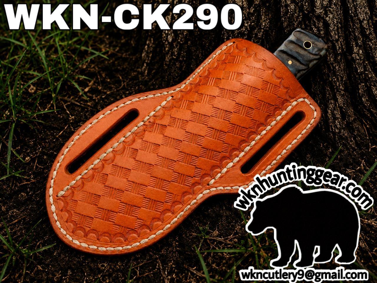 Leather woven knife sheath on dirt and grass with a knife handle peeking out; branding text and bear logo watermark from wk hunting gear in the image.