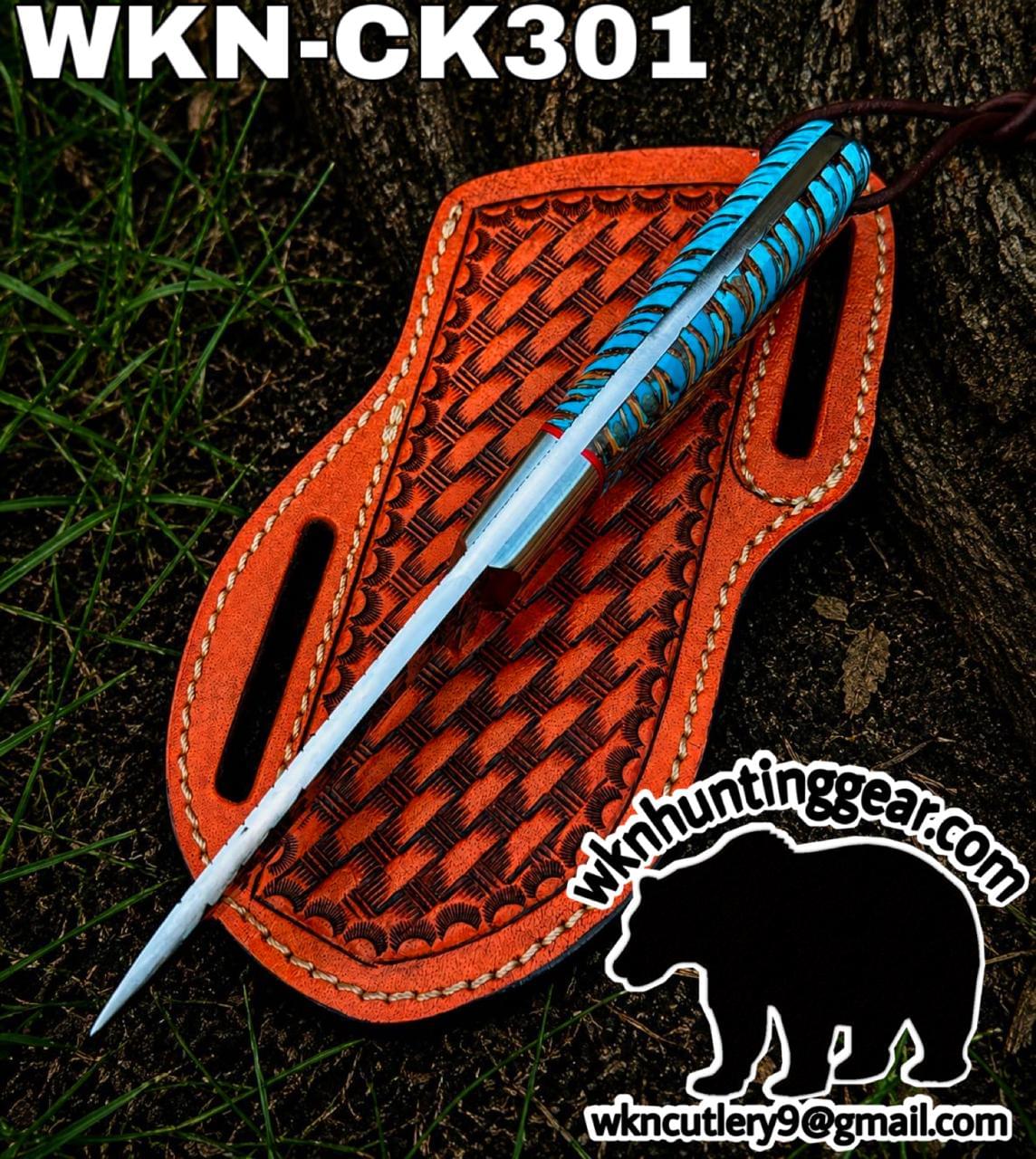 Knife with a blue-turquoise handle rests on an orange leather sheath outdoors; includes visible logo and email at bottom right.
